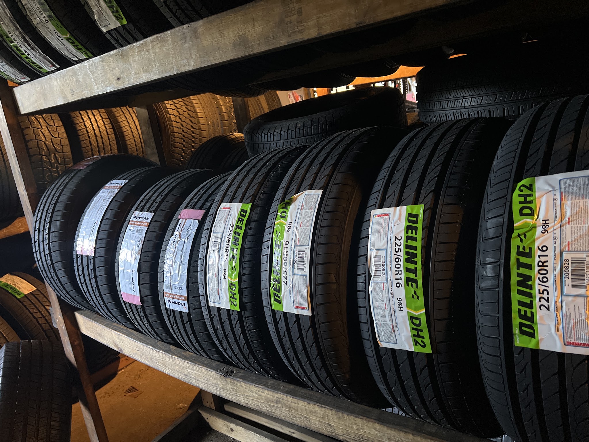 Rows of tires on a wooden rack
